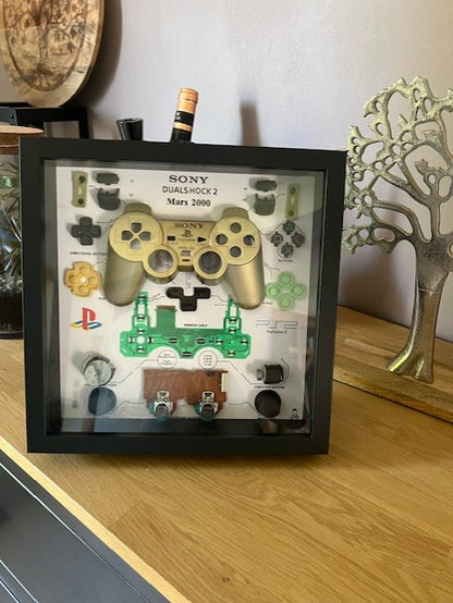 Cadre manette playstation 2 or