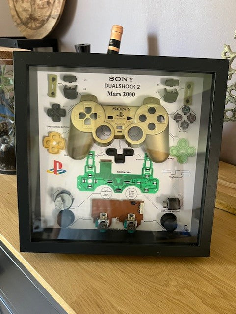 Cadre manette playstation 2 or