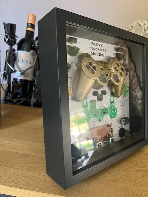 Cadre manette playstation 2 or